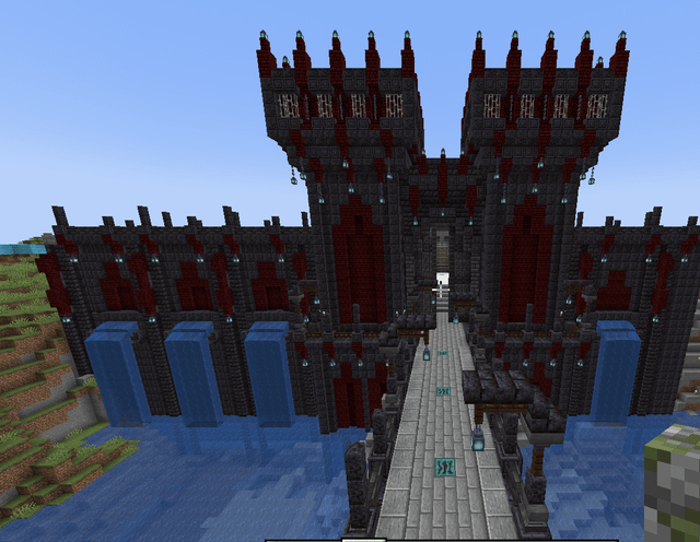 large castle build I'm working on. the main entrance and start of the outer walls!